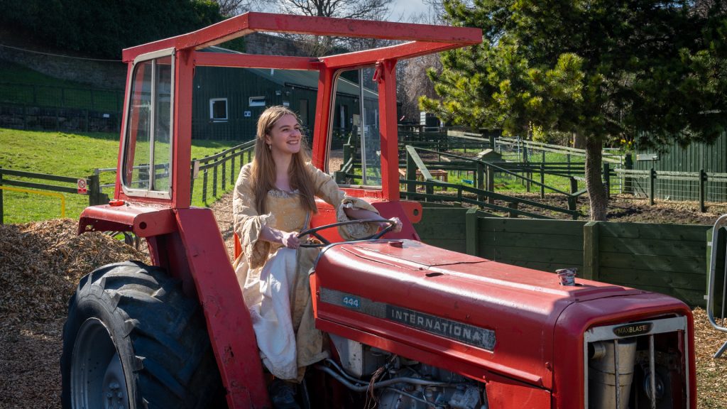 Mary King on a tractor
